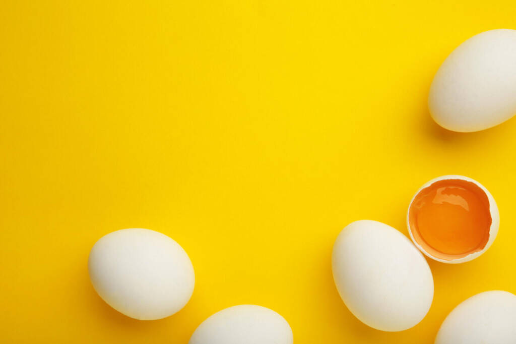Easter,Decoration,White,Eggs,On,Yellow,Background.,Top,View
